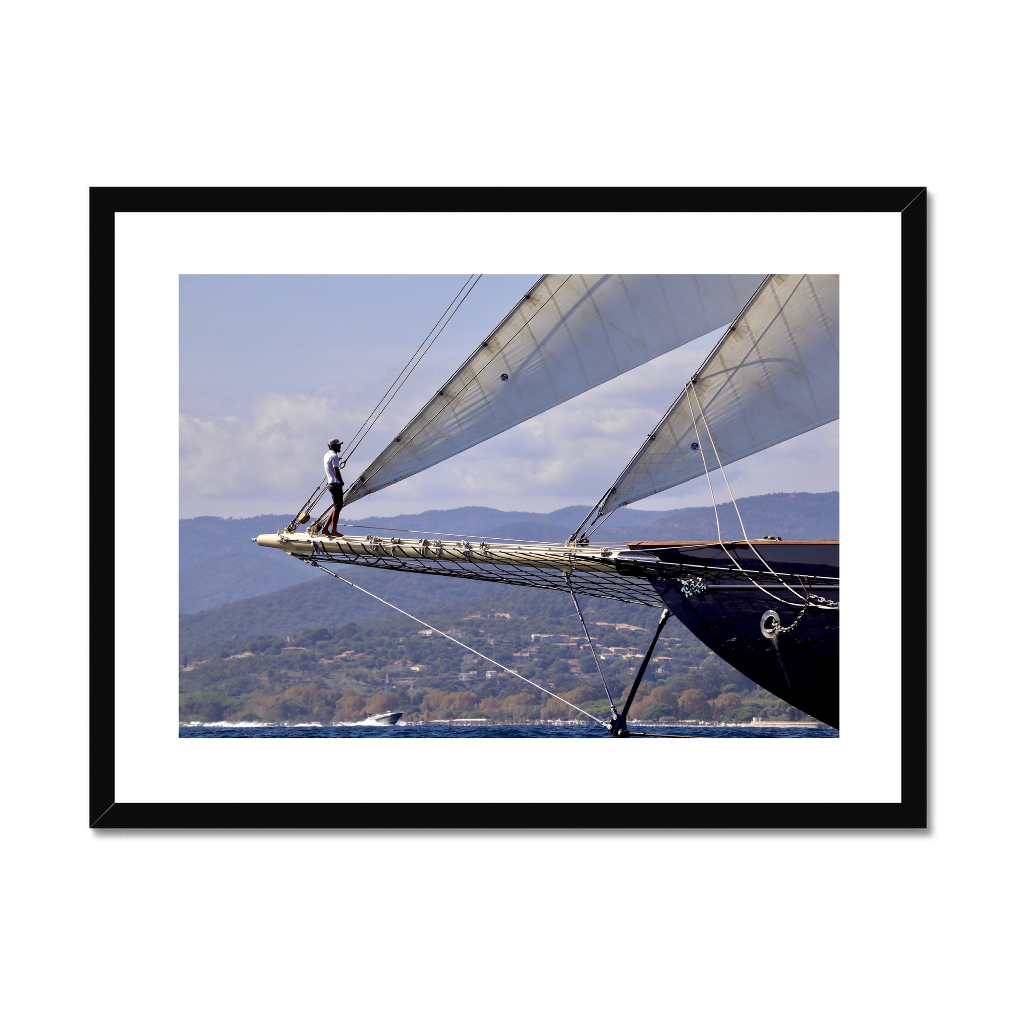 South of France Photos framed print - Man standing on the end of a sailing yacht at Les Voiles de Saint Tropez